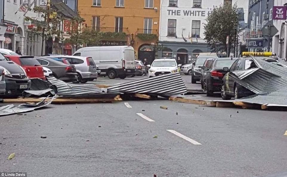 Corrugated iron has been blown across Pearse Street in Kinsale, County Cork, as Ireland is hit by 92mph winds