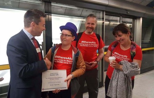 Mark Wild, managing director of London Underground, presents Ally with a certificate