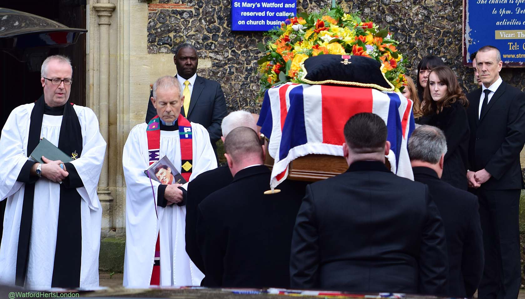 The Union Flag covered his coffin, on which his OBE was placed.