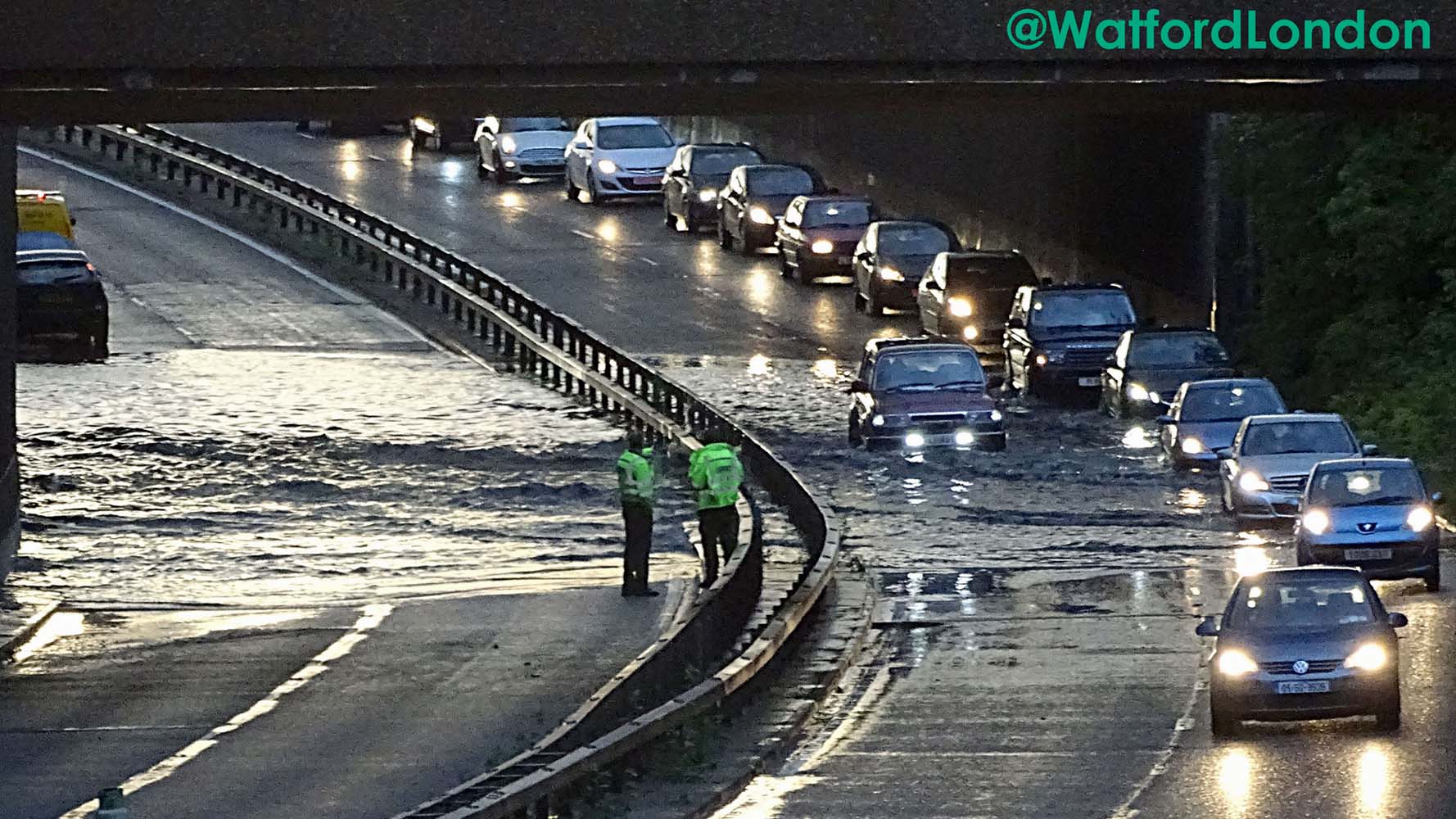 Watford A41 flooding into a river as heavy rain downpour video