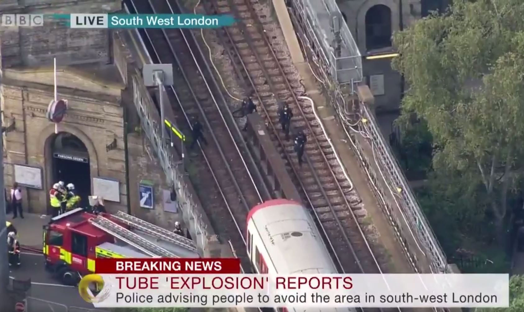Armed Police swoop the train tracks  at Parsons Green underground tube station in west London