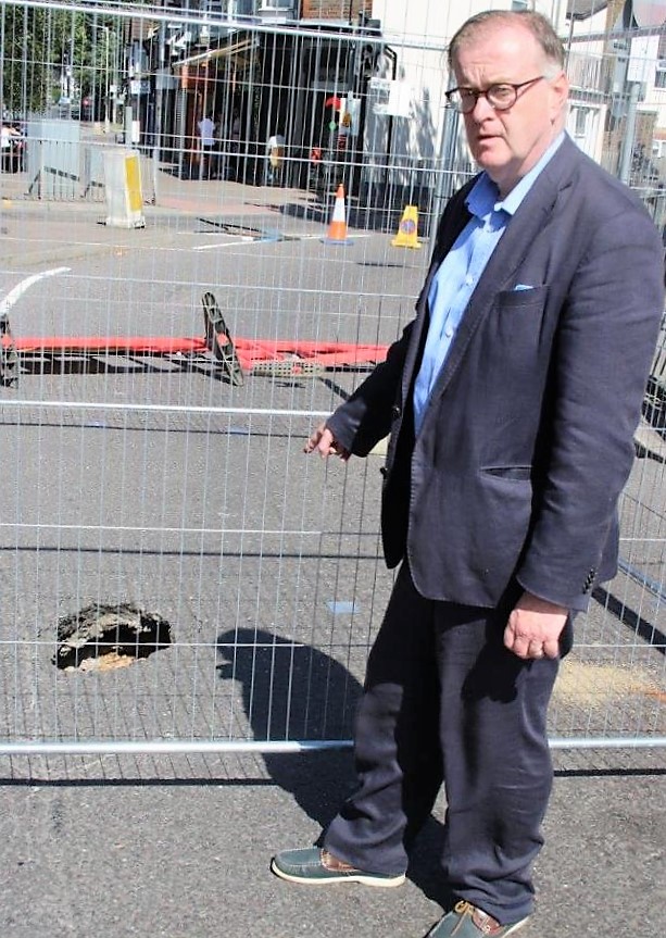 County Cllr Nigel Bell is frustrated over the delays that have kept an important access road for the hospital Emergency dept closed for 4 days.