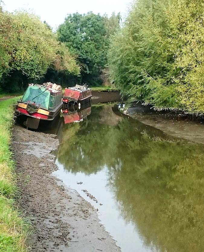 Canal Leaks Dry Boats Stuck in the Mud