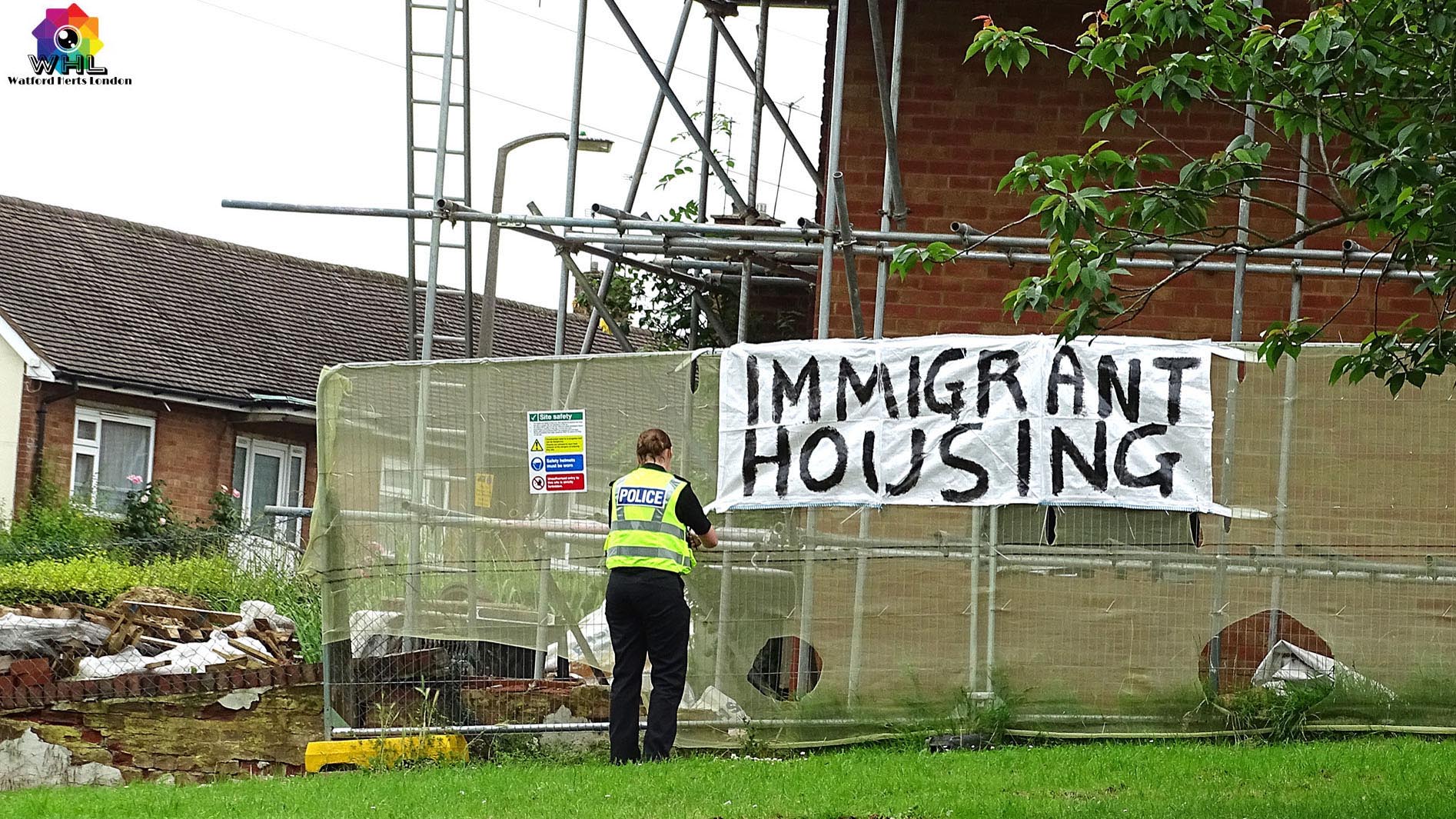 Police Remove Immigrant Housing Graffiti Banner on House in Meriden Watford 2016
