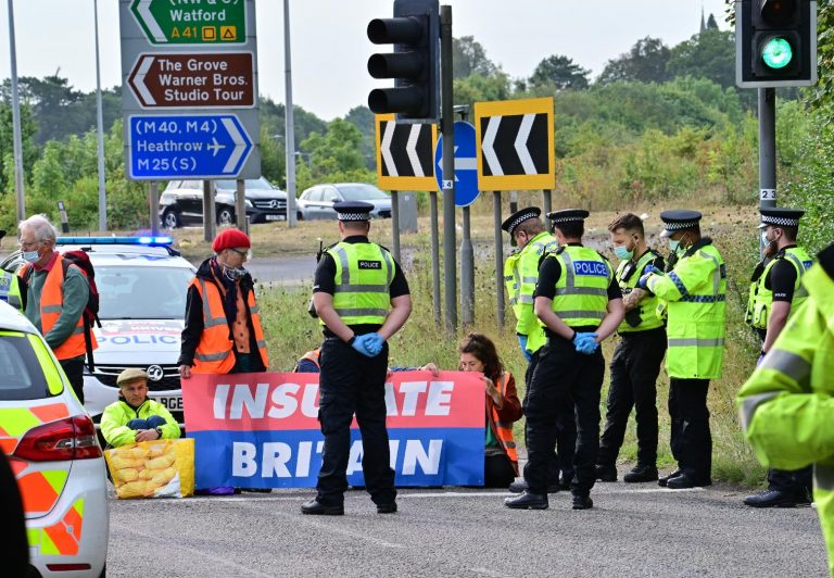 Climate protesters block A41 M25 roundabout with Police make arrests