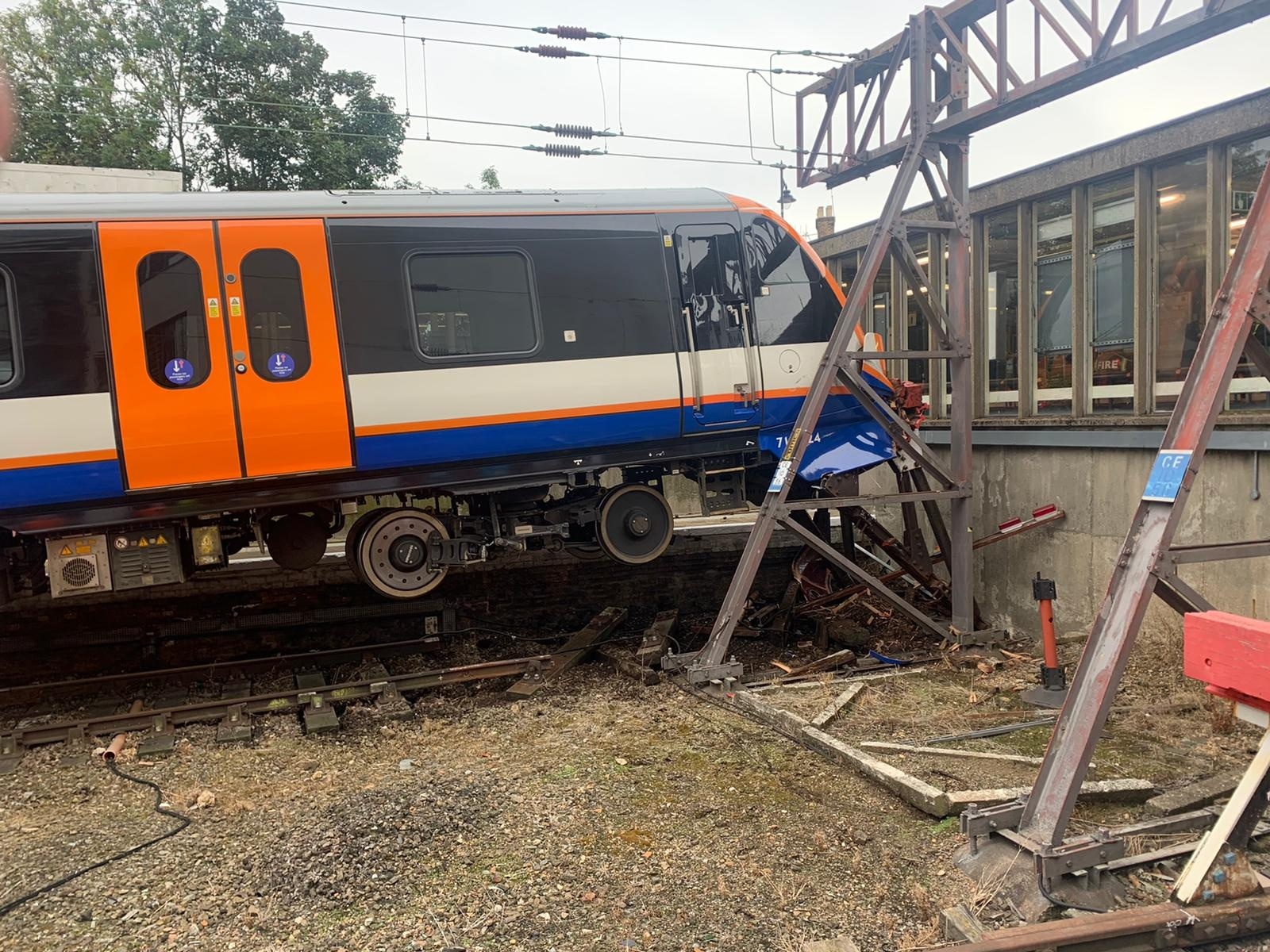 Train crashes through buffers injuring two people