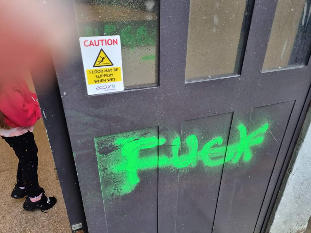Housing Block vandalised by abusive graffiti Hooligans