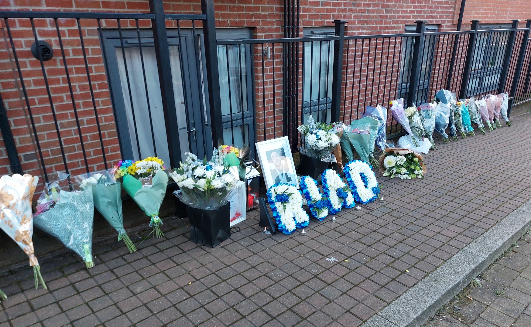 Family and friends laid Tributes where brother died in three storey fall in Watford
