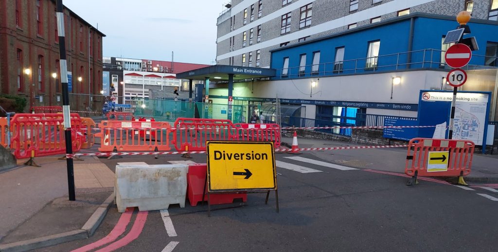 Watford, Sinkhole, hospital, 2022, tarmac, lesk, pipes, road, barriers, closed,