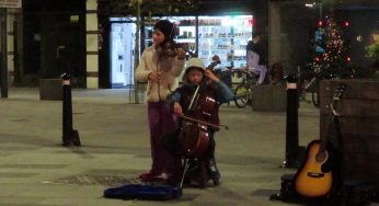 Children Busking for Money Playing Christmas Music