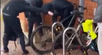Moment thieves use a grinder to steal a bike outside a busy rail station in broad daylight 