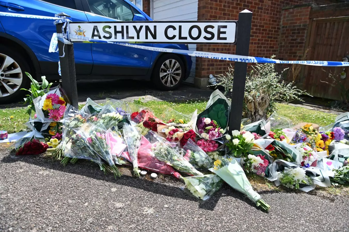 Flowers and Tributes were laid for the victims Carol Hunt, 61, the wife of the BBC horse racing commentator John Hunt, and two of their daughters Hannah Hunt, 28, and Louise Hunt, 25, all tragically died at the scene.